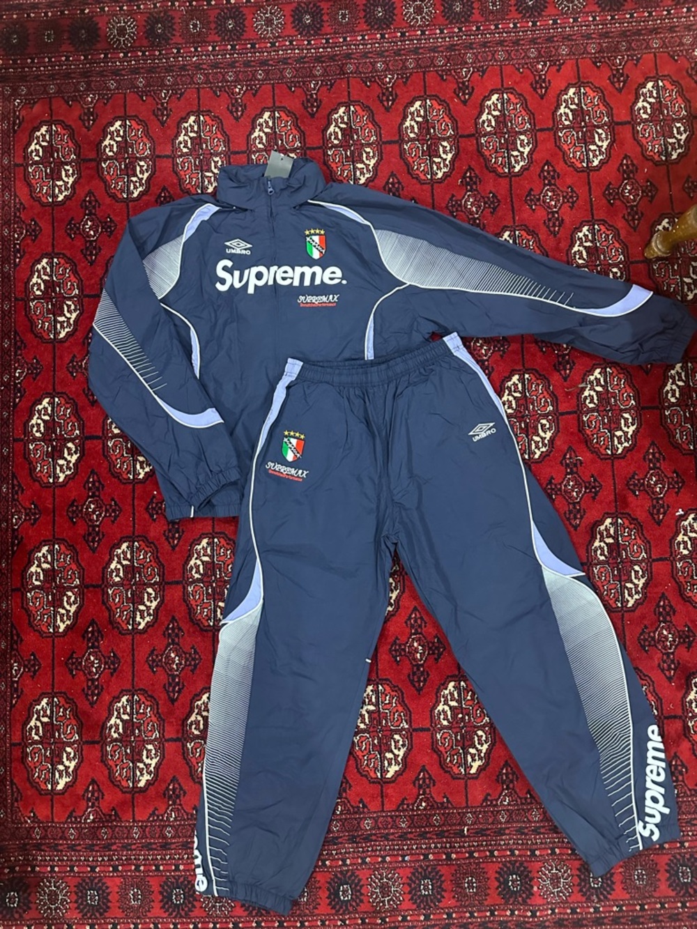 Supreme x Umbro Navy Track Shorts with Red Supreme Tag